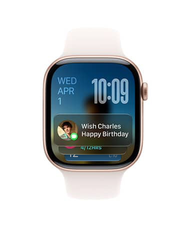 라이트 블러시 밴드가 장착된 로즈 골드 색상 Apple Watch Series 11. 왼쪽 상단에 날짜, 오른쪽 상단에 시간, 하단에 메시지 위젯이 표시된 모습
